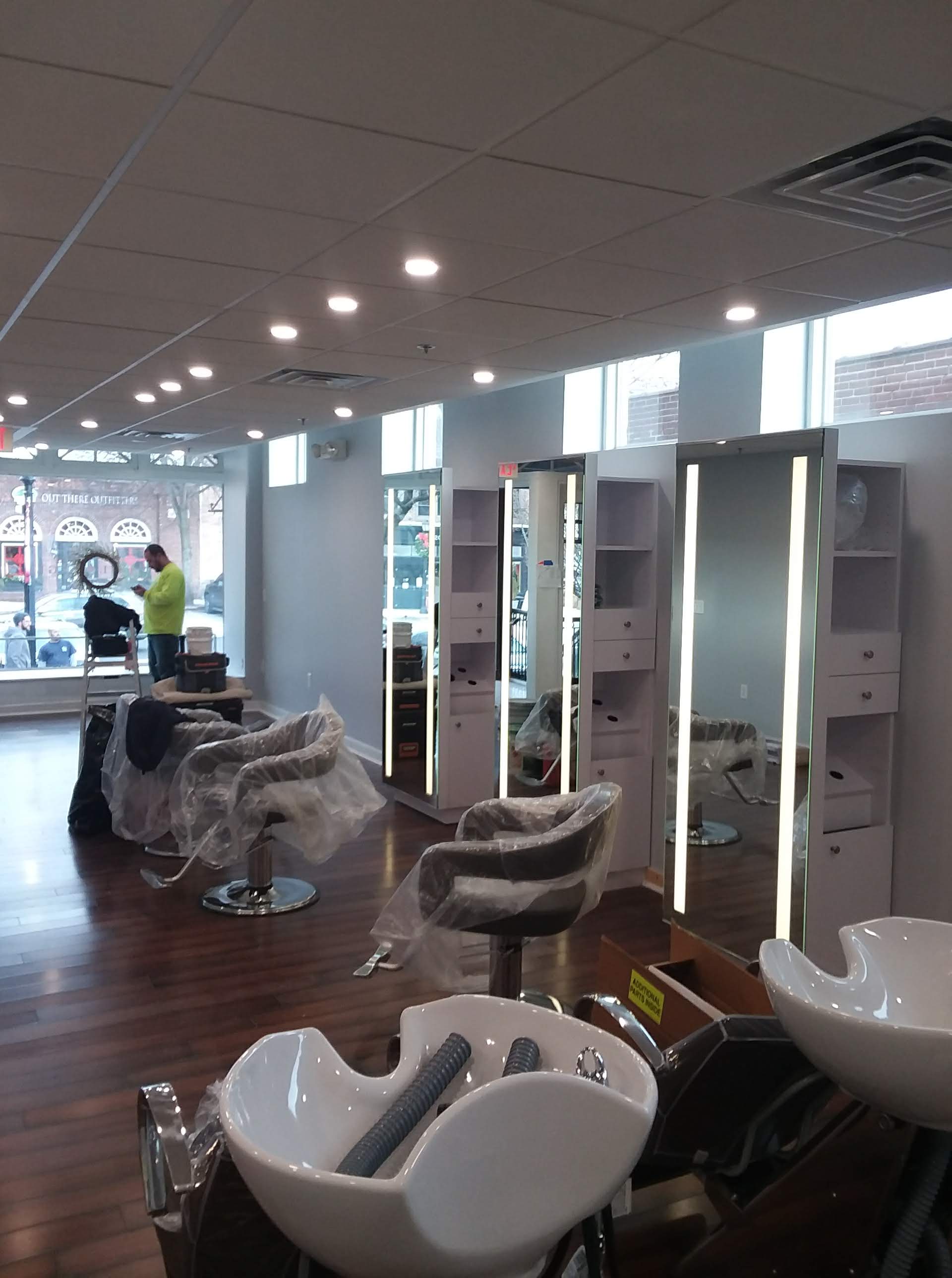 interior of salon work areas with freshly painted work areas, chairs and Hair washing areas